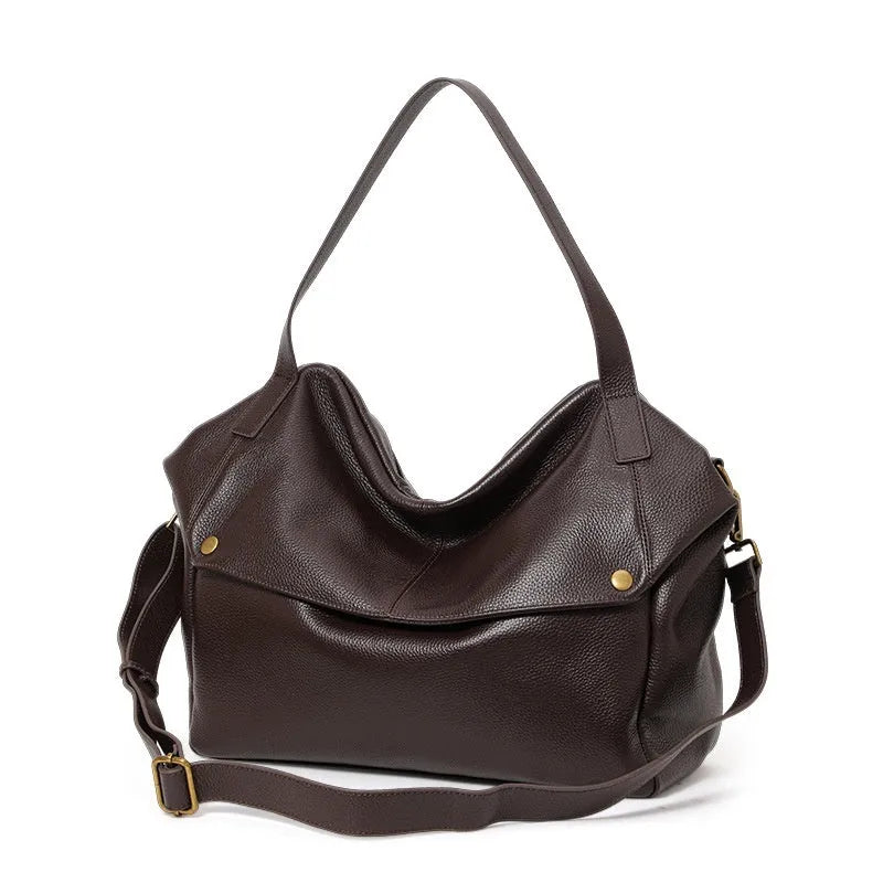 Brown genuine leather women's shoulder bag with a horizontal square shape and shoulder strap.