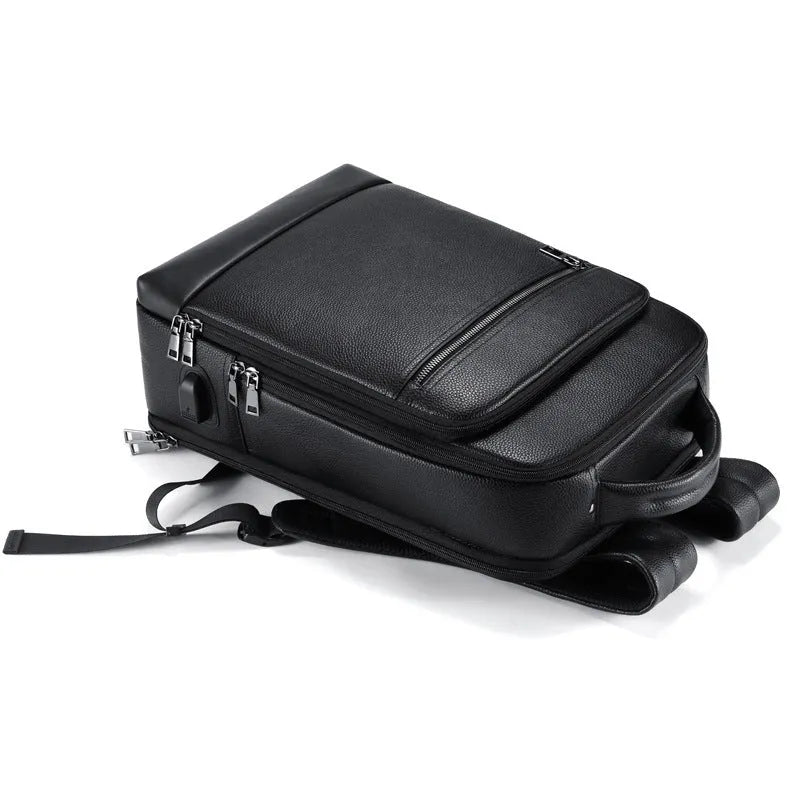 Black genuine leather men's business computer backpack with curved shoulder strap and sewing line detailing