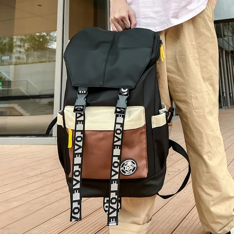 Oxford cloth backpack shown in black, green or red with handheld and shoulder straps.