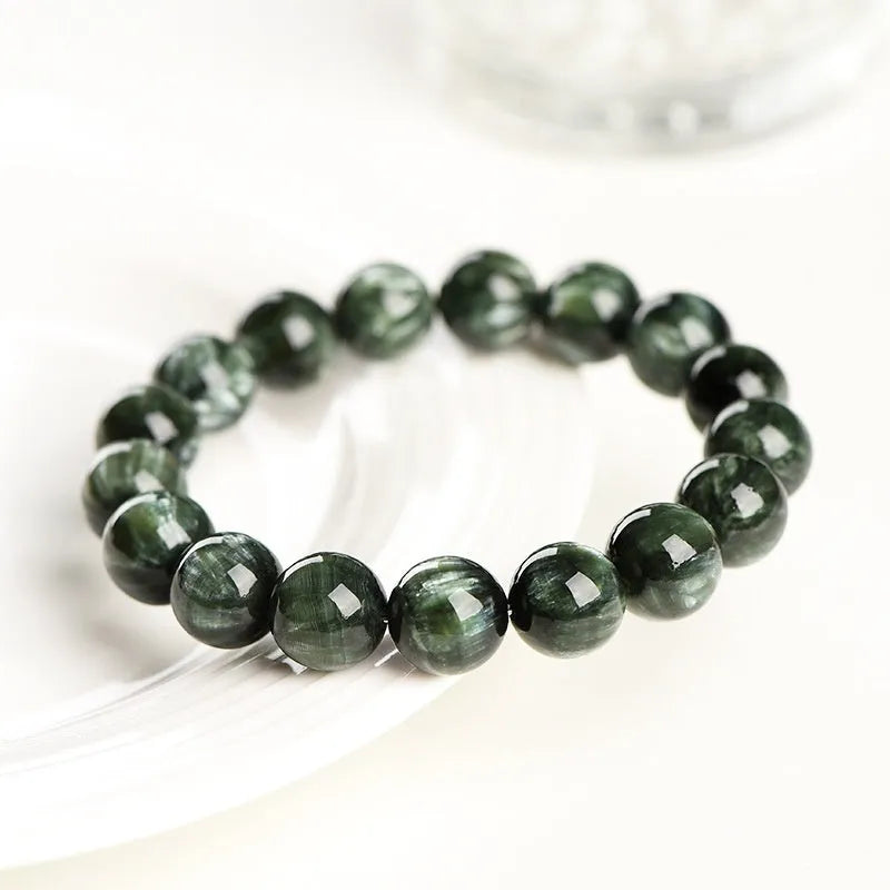 Natural green dragon crystal bracelet with 8-9mm round beads and geometric ruyi design.