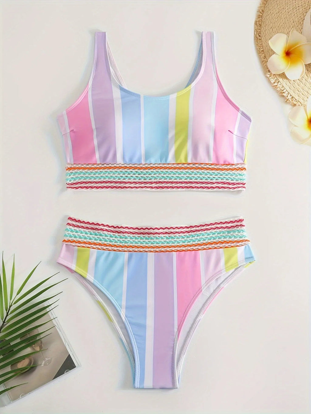 Women's striped sports bikini top and briefs set on a white background
