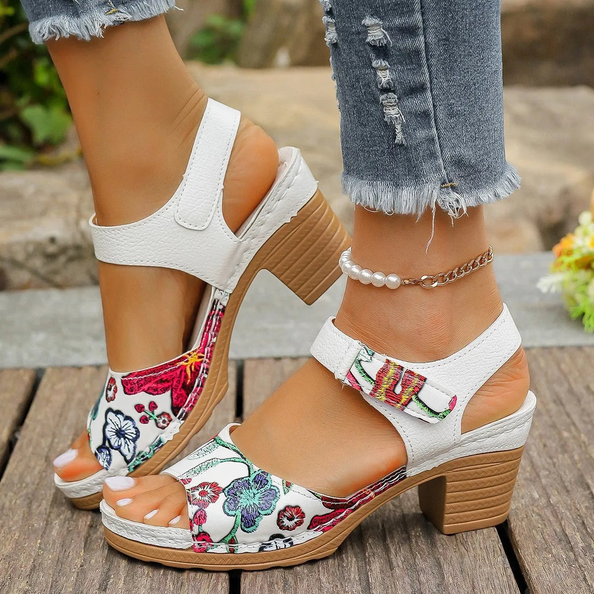 White women's casual high heel sandals with a Velcro strap buckle on a rubber sole.