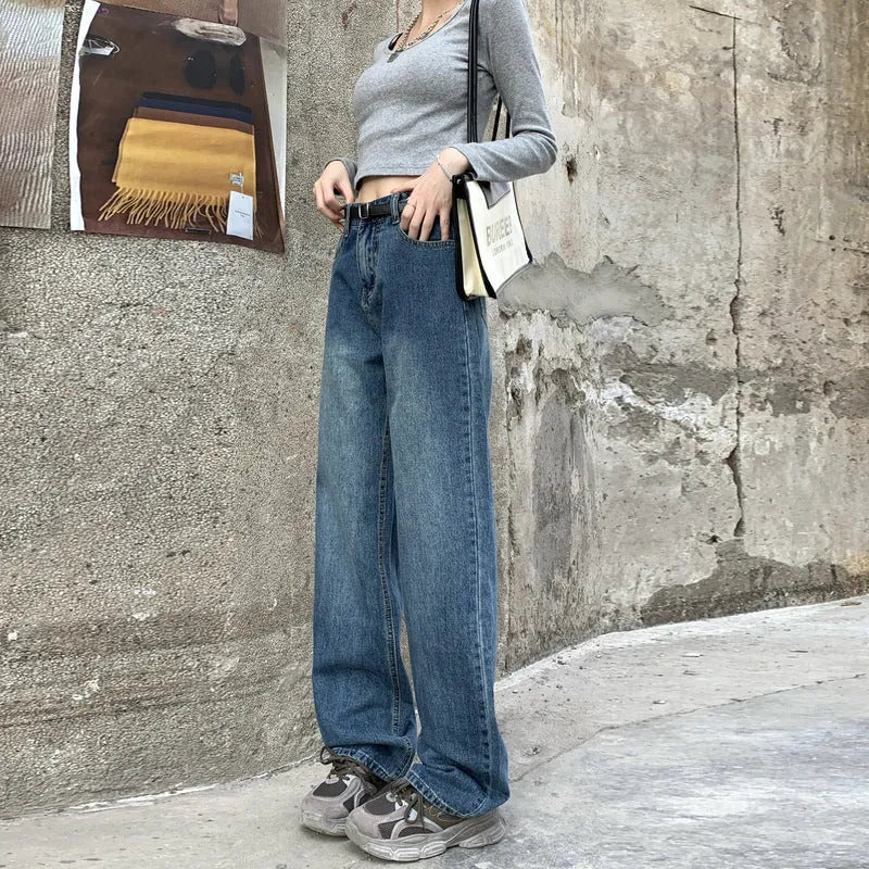 Women's retro blue high-waisted straight leg denim jeans on a neutral background.