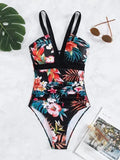 Women's floral print backless one-piece swimsuit on a hanger.