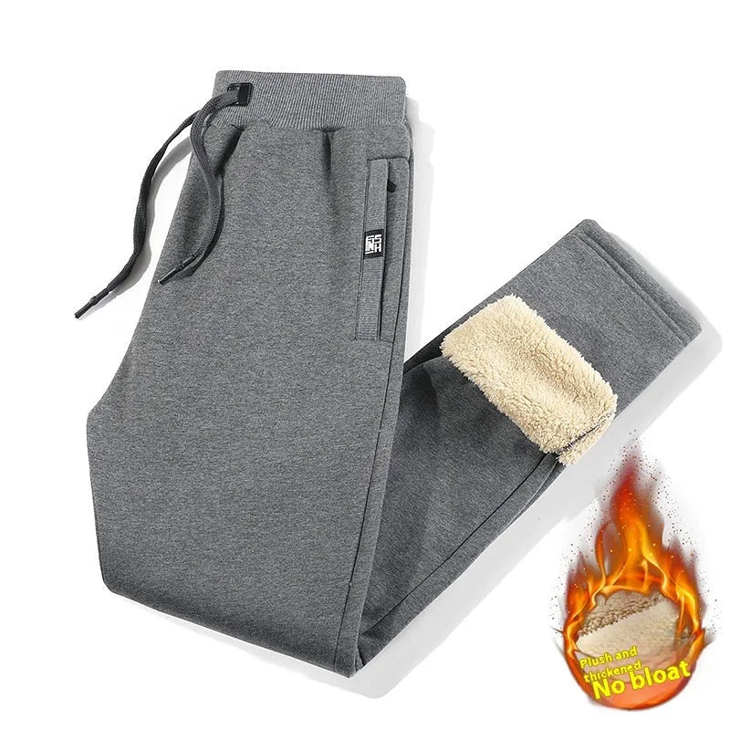 Men's grey fleece-lined track pants with elastic waistband shown flat
