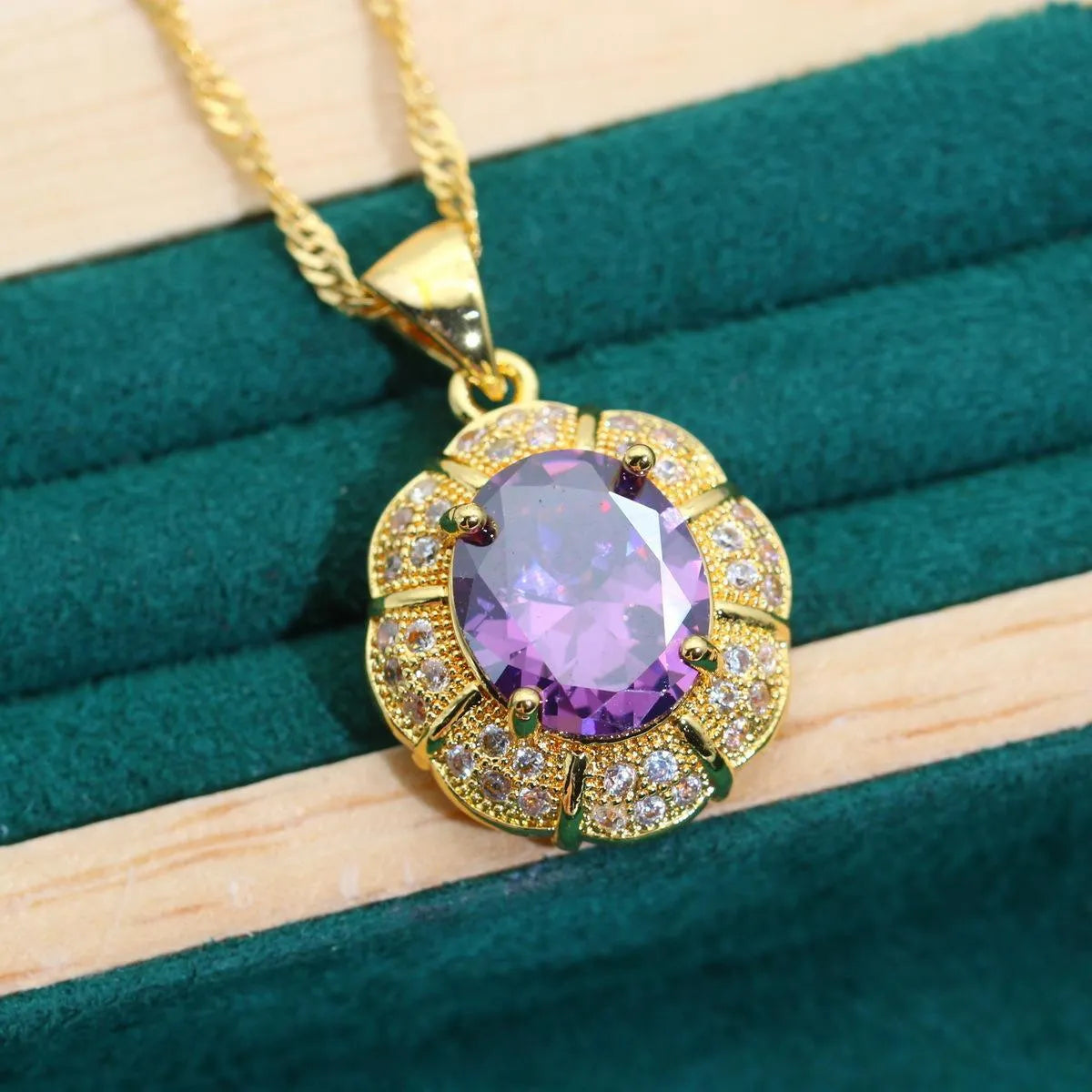 18k gold plated cubic zirconia jewellery set showing necklace, earrings, ring and bracelet in four colour options