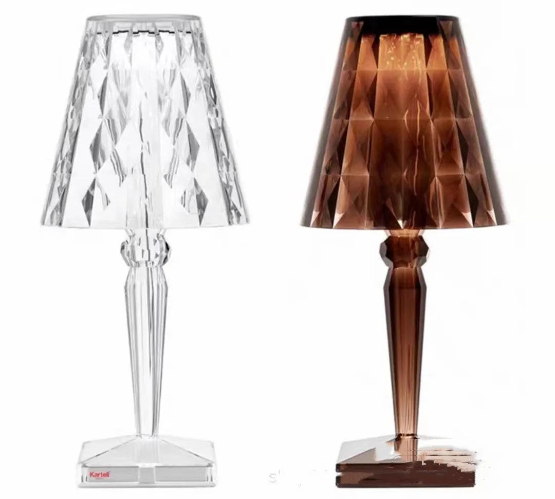 Rose gold portable touch night light with acrylic lamp holder on a surface