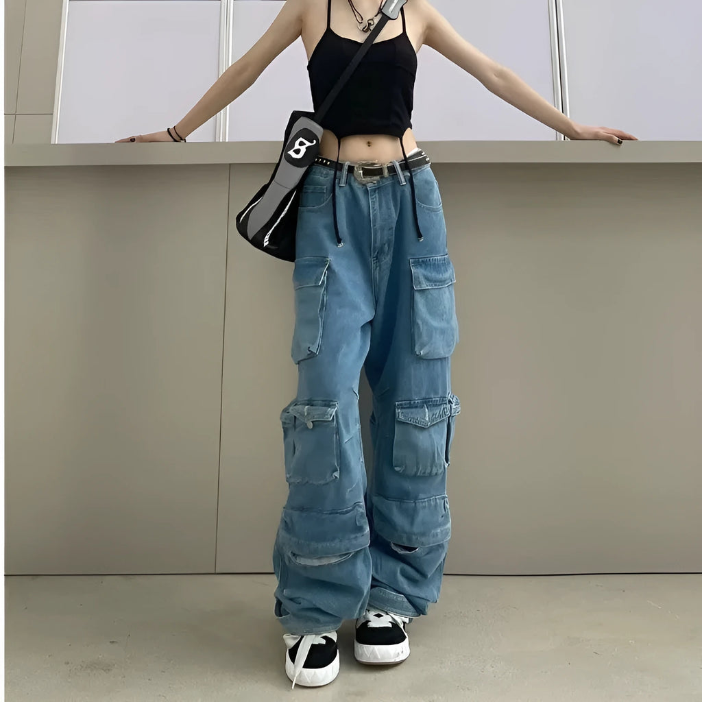 Woman wearing blue tie-dyed high waist wide leg jeans with multiple pockets in a street style setting.