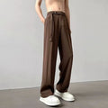 Man wearing thin straight-cut wide leg casual trousers in black, showcasing the loose fit and straight leg opening.