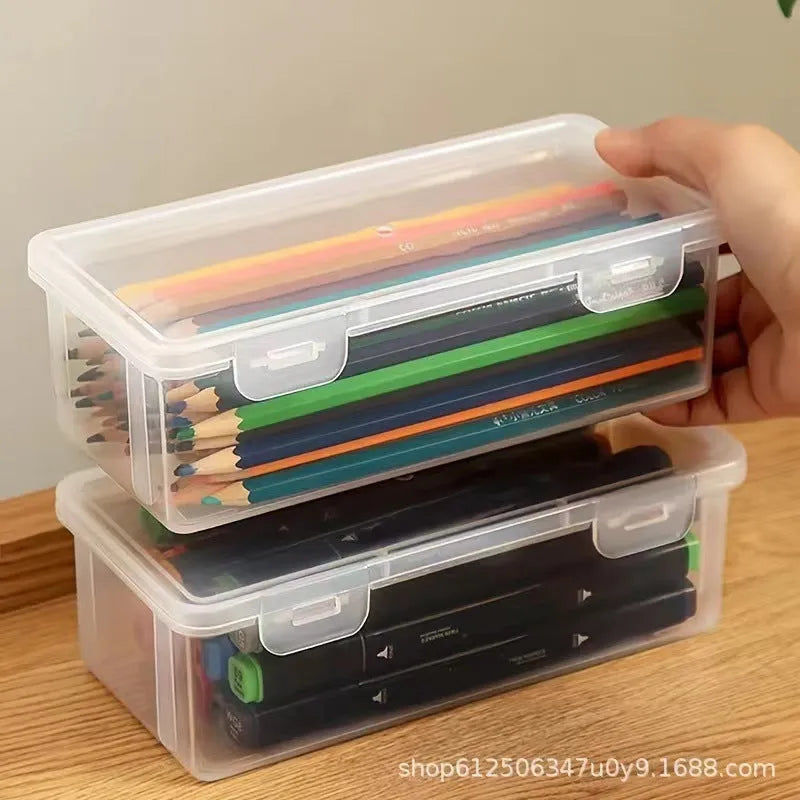 Transparent plastic pencil storage box full of coloured pencils and crayons