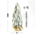 Small 24-inch white plastic Christmas tree with lights and snow sprayer decoration