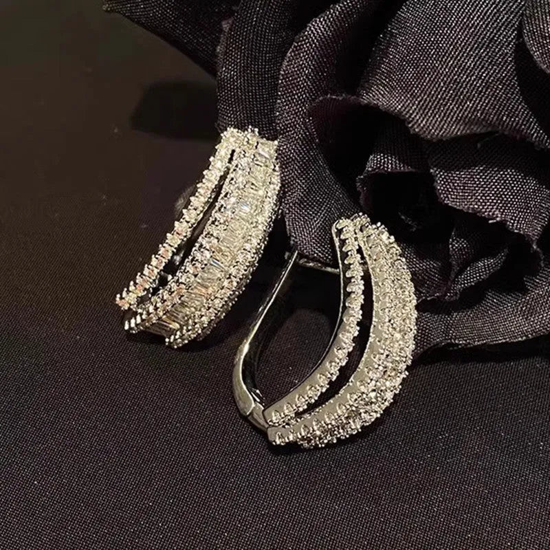 Geometric white gold colour stud earrings with zircon stone detail for women