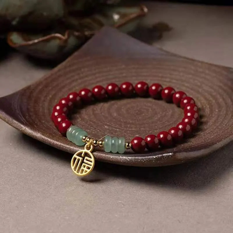 Wave-shaped bracelet with cinnabar segments and copper beads in national style design
