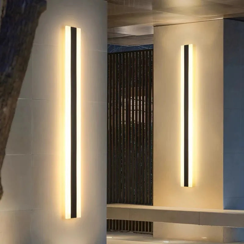 Straight outdoor LED wall lamp with IP65 waterproof rating installed on exterior brick wall