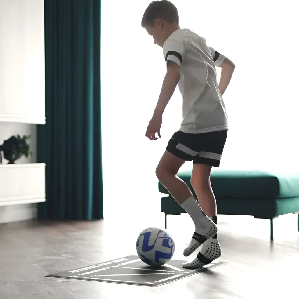 Black rectangular football training mat measuring 60cm by 90cm