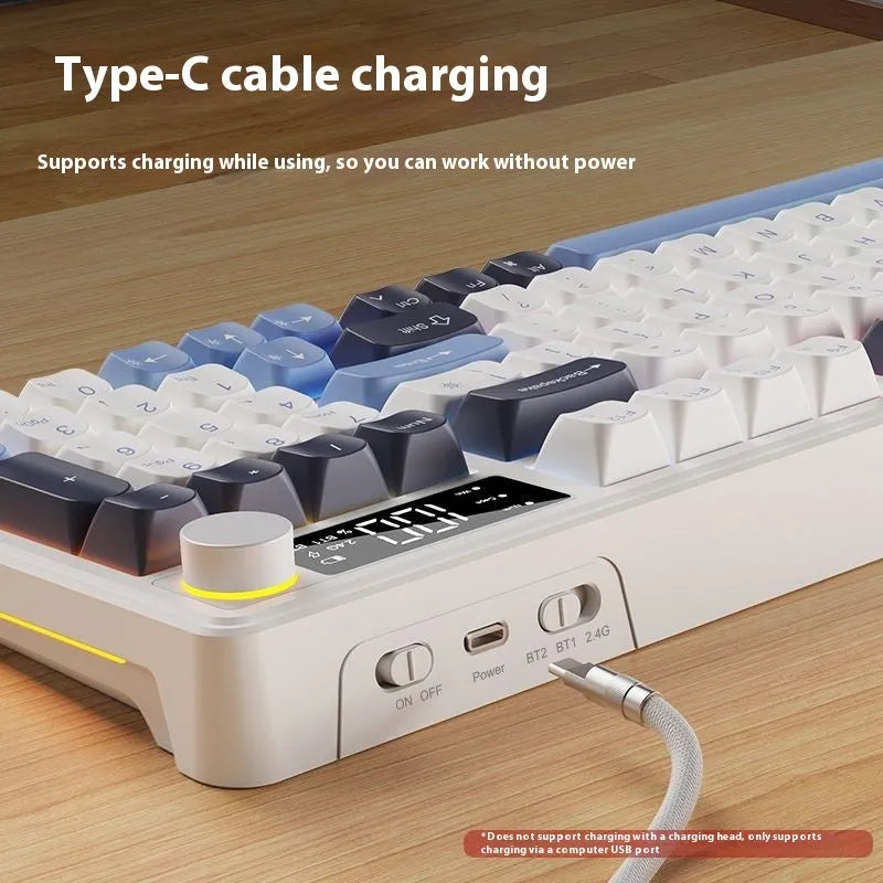 Blue and white wireless keyboard and mouse set on a desk, showing ball cap keycaps and compact design.