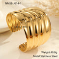Women's wide fashion bracelet with gold plating and geometric wave design