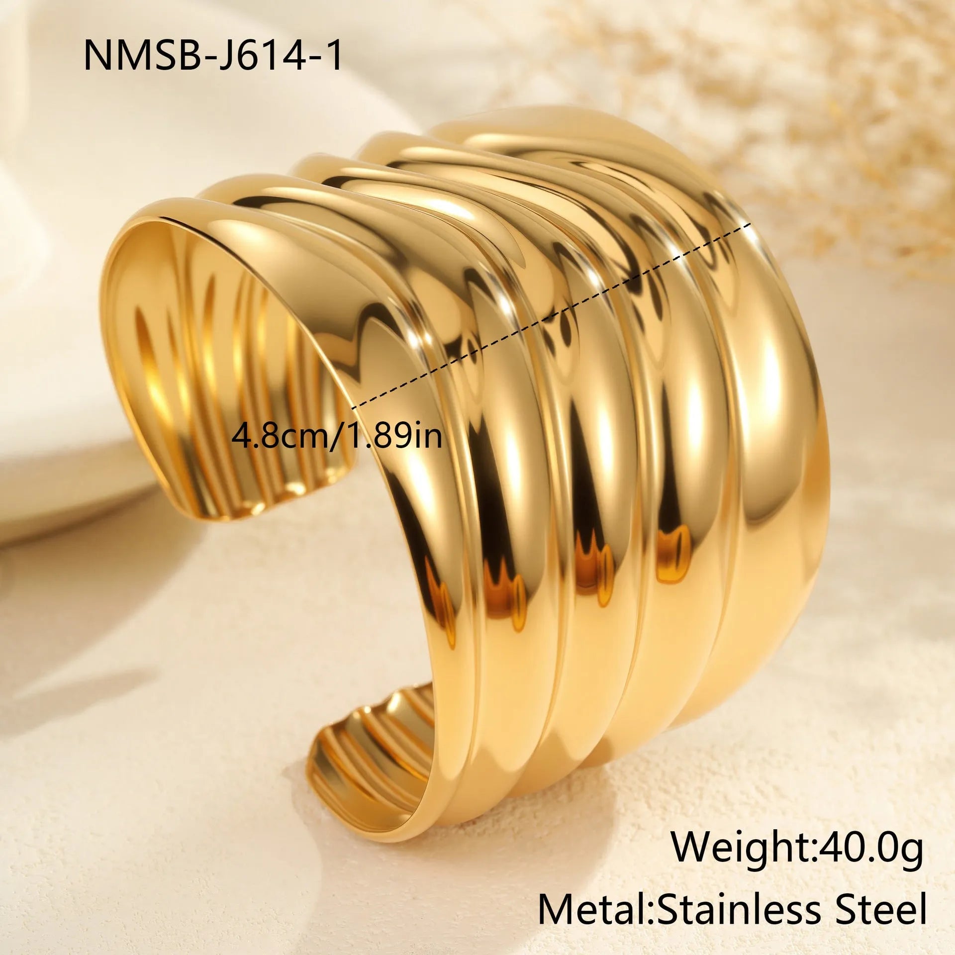 Women's wide fashion bracelet with gold plating and geometric wave design
