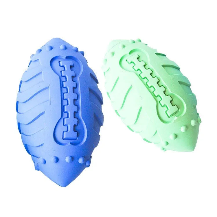 Light green rugby ball shaped dog chew toy with textured rubber surface for interactive play