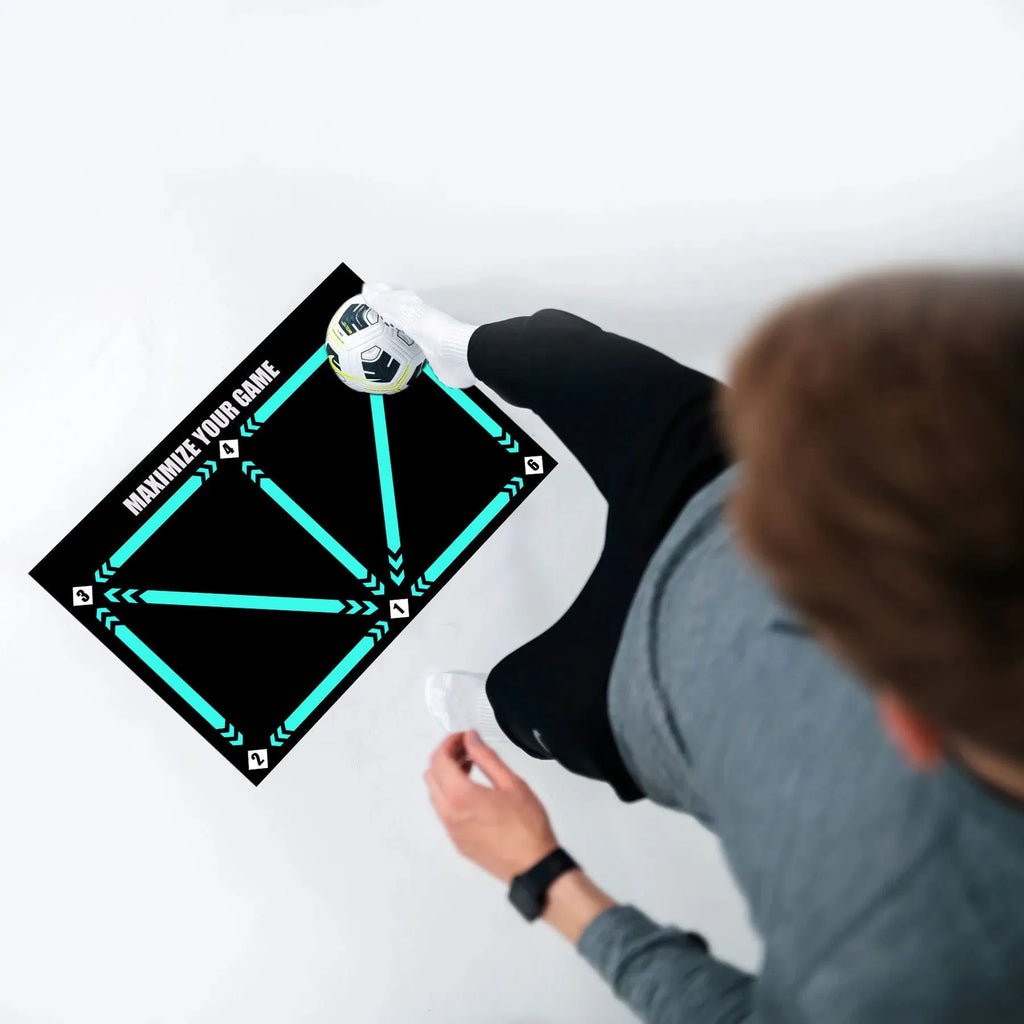 Black rectangular football training mat measuring 60cm by 90cm