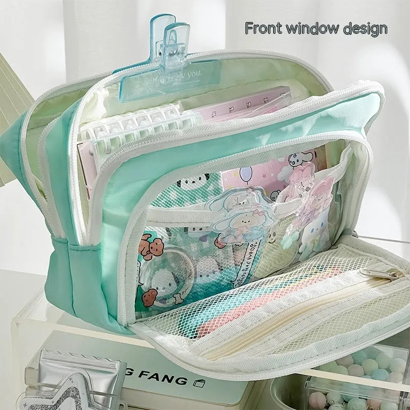 Double layer high capacity pencil case in blue with gift handle, showing zippered compartments.