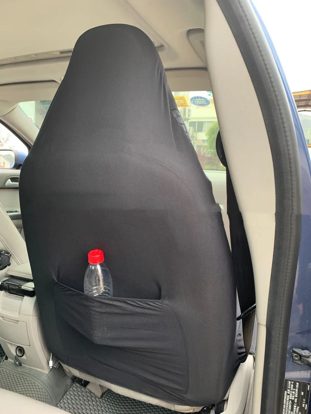 Black quilted automotive seat cover with PU and polyester construction