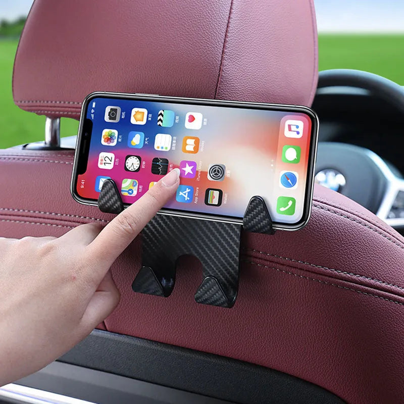 Black ABS plastic car multifunction hook and mobile phone holder bracket for rear seat storage.