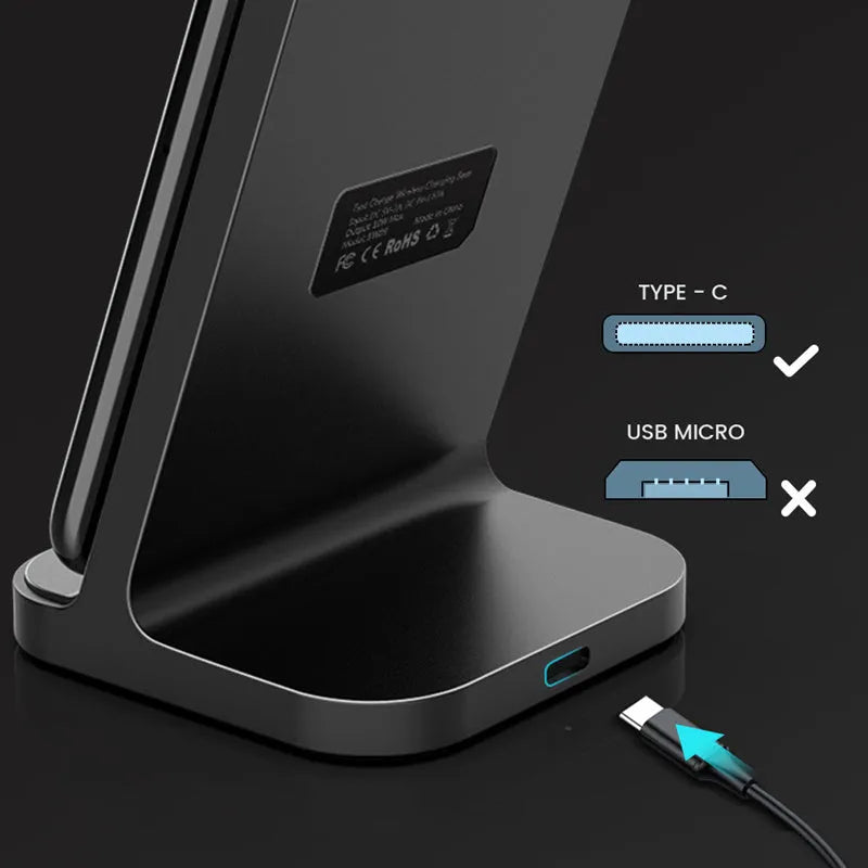 Dark grey vertical wireless charging stand for smartphones on desktop