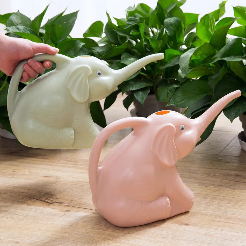 Pink plastic baby elephant-shaped watering can with a long nozzle and handle.