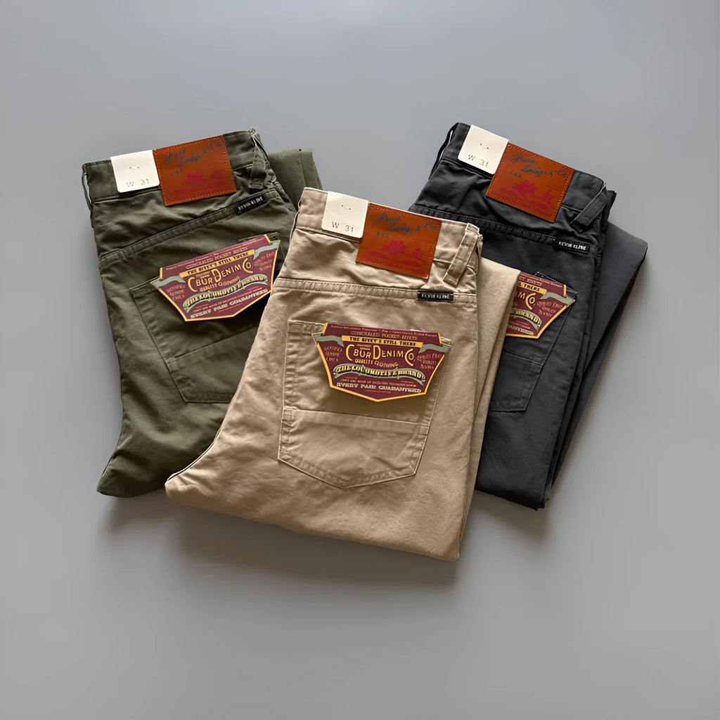 Men's straight leg casual cotton trousers in grey, army green, and khaki colours on a mid waist.