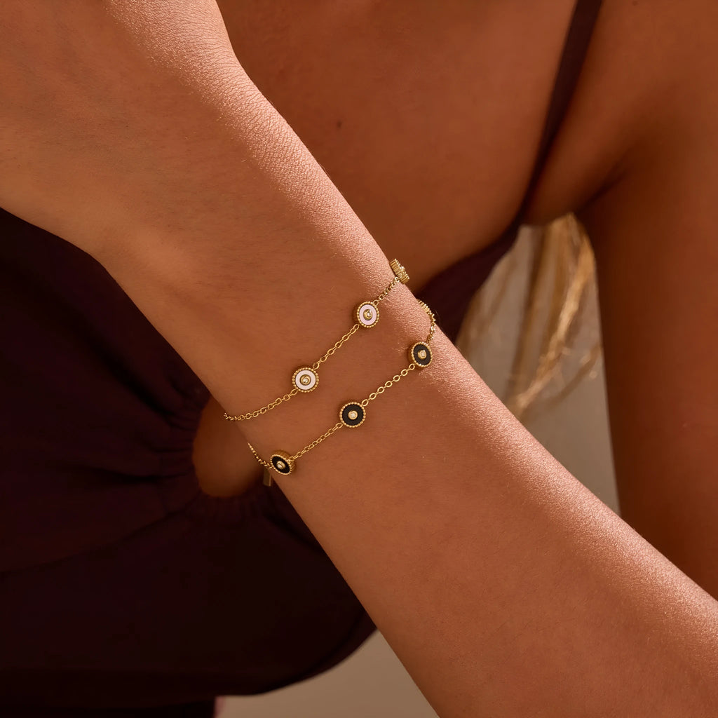 Stainless steel bracelet and necklace set with 18K gold plating and geometric fritillary design