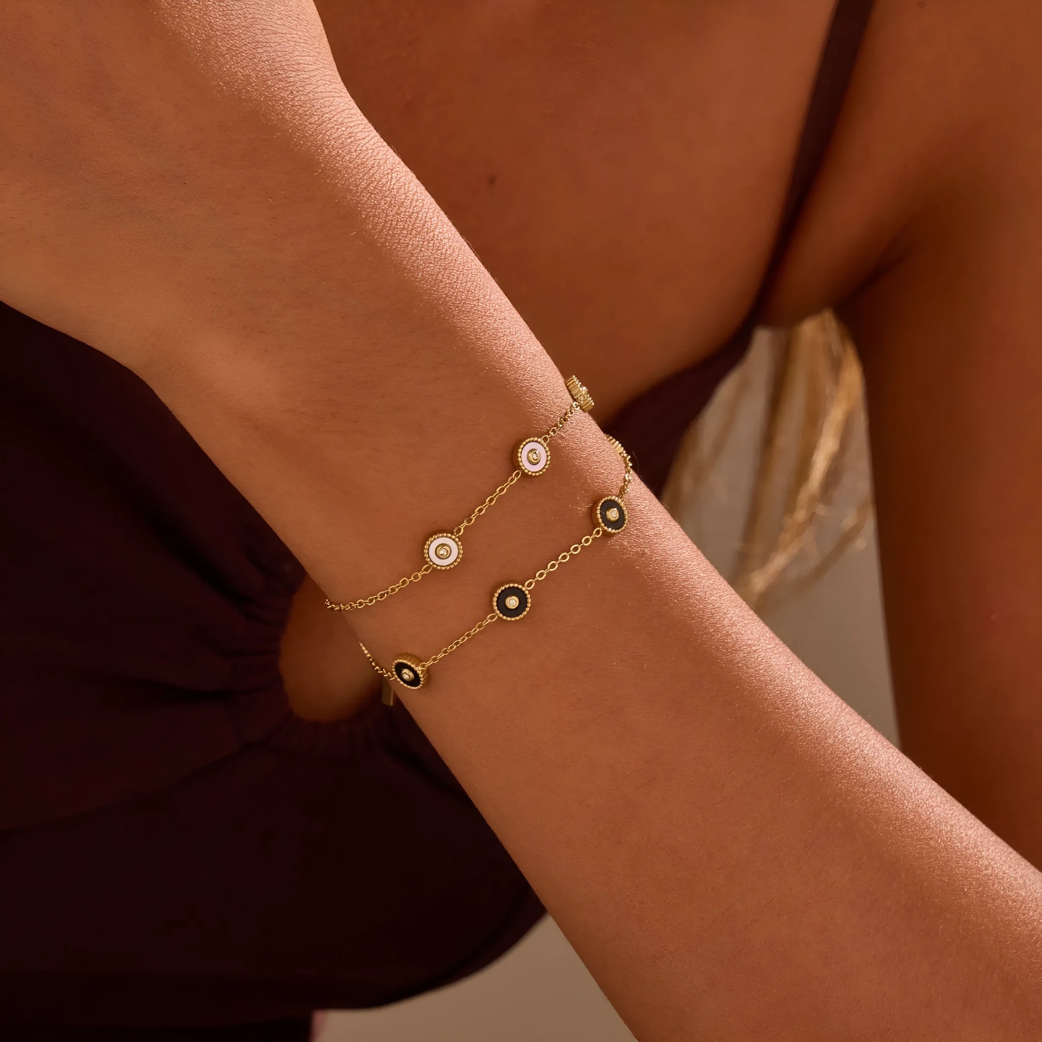 Stainless steel bracelet and necklace set with 18K gold plating and geometric fritillary design