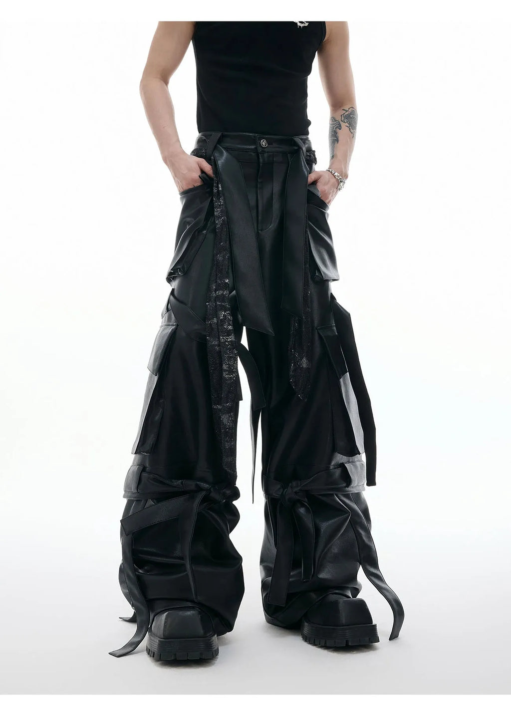 Black loose-fit retro trousers with quilted panels and multi-pocket stitching detail.