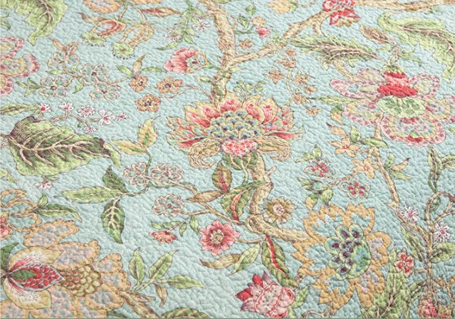 Blue American style cotton bedspread with plant and flower pattern, quilted texture