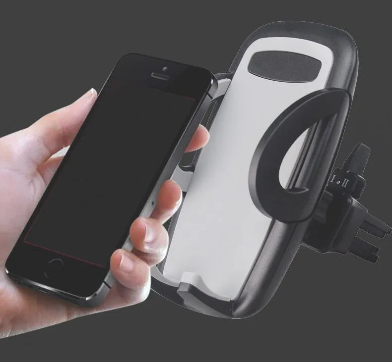 Black plastic car air conditioning vent mobile phone holder mounted on vehicle dashboard