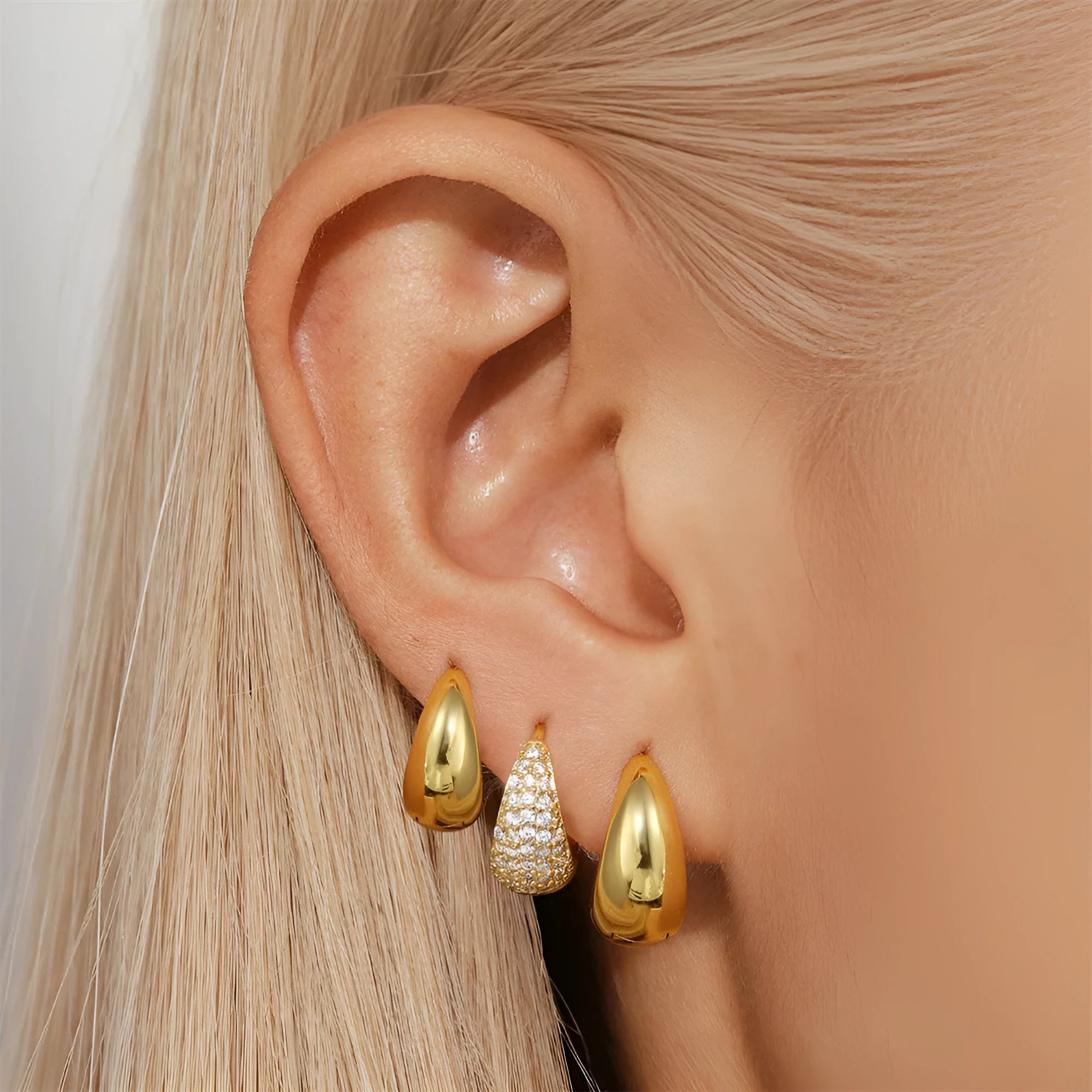 Brass diamond earclip earrings with electroplated gold finish and geometric round design