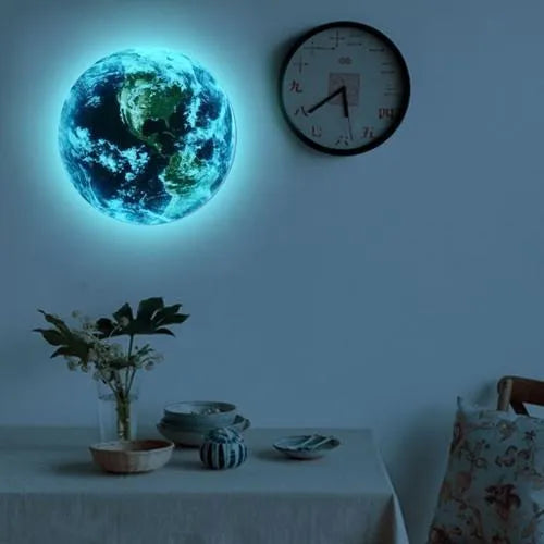 Glow in the dark 3D Earth planet wall sticker in multiple sizes on a dark wall.