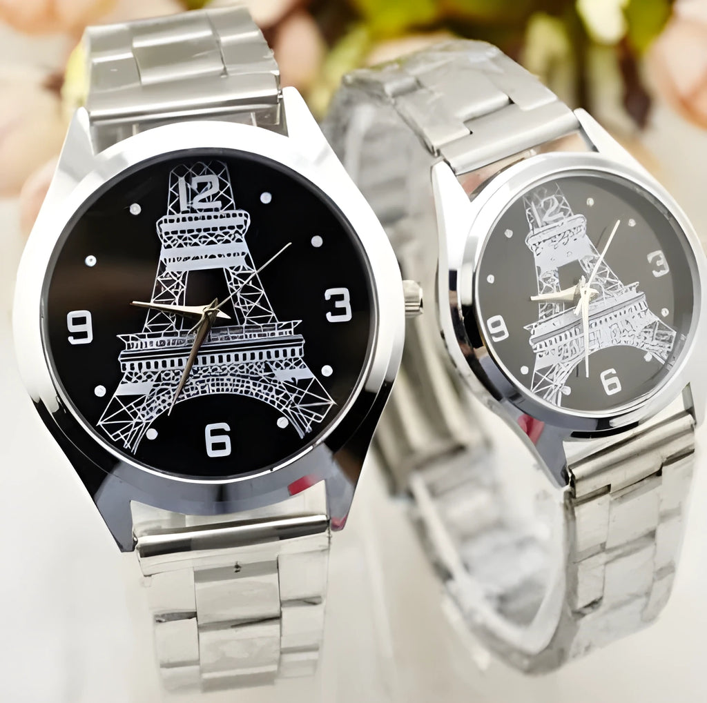 Eiffel Tower themed wrist watch with stainless steel mesh strap on an adult wrist.