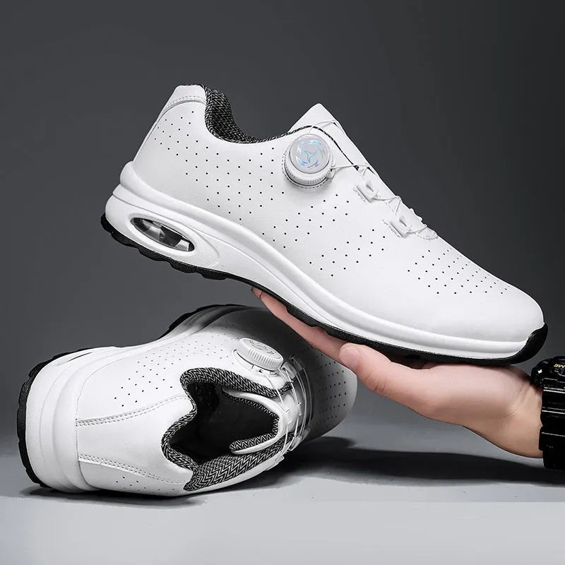 Black and white low top casual shoes with mesh upper, composite sole, and cross shoulder straps