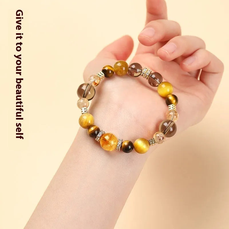 Tiger-eye crystal bracelet with Jinba symbol and geometric tower design in natural yellow