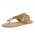 Women's black slip-on sandals with rhinestone details on flip-toe hollow design.