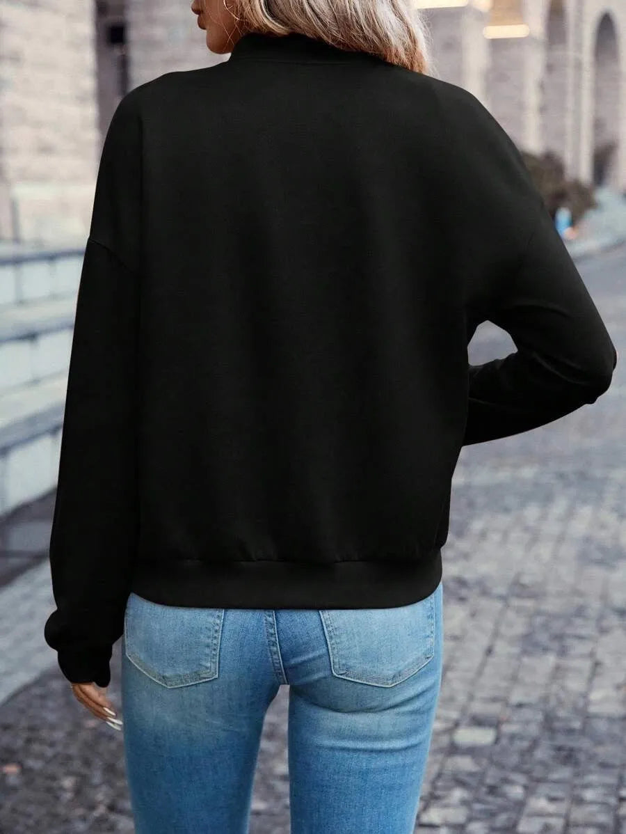 Black women's casual zip-up jacket with long sleeves and faux pockets on the front.