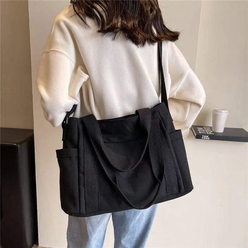Large capacity polyester shoulder bag for women in four colours with mobile phone compartment