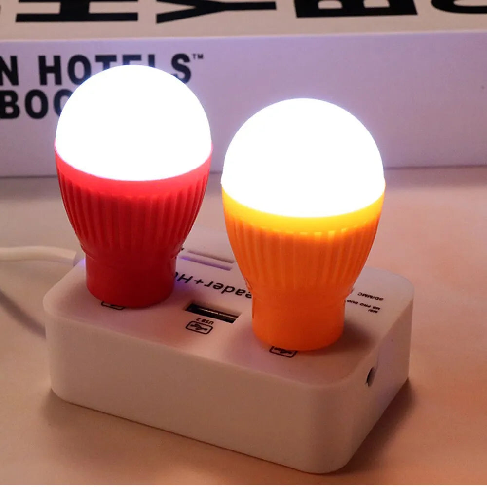 Mini USB LED lamp portable night light in black with USB cable, showing compact design for travel use