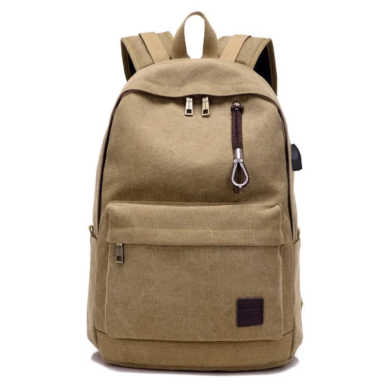 Canvas backpack with USB charging port showing laptop compartment and multiple pockets in grey colour