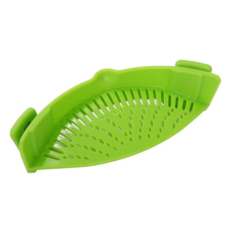 Silicone clip-on kitchen strainer attached to pot rim draining liquid
