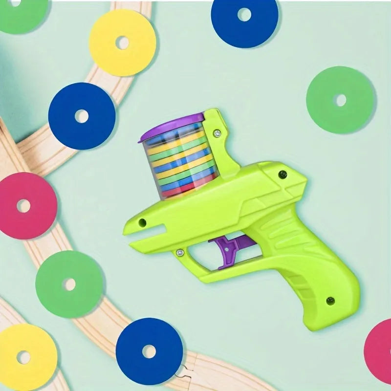 Manual cat toy launcher with foam discs in green and purple colour options for indoor feline play