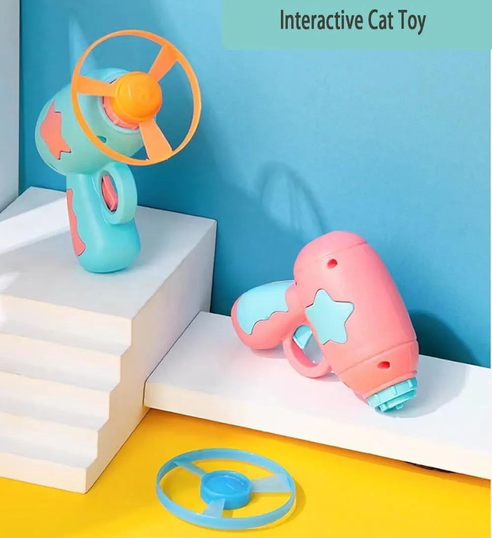 Blue plastic cat toy gun with spinning Frisbee launcher for indoor cat play