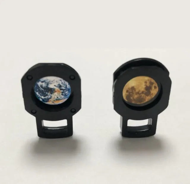 Earth and moon projection lamp with adjustable bracket on wooden surface