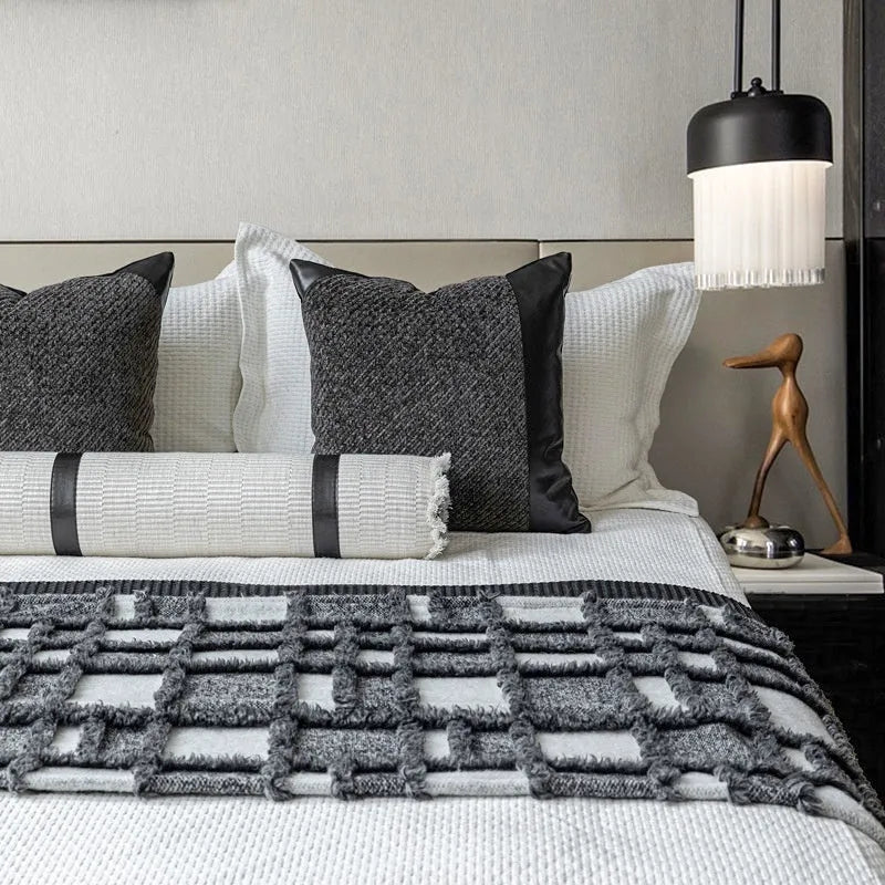 Modern minimalist grey and white plaid polyester bed runner set with pillow on a bed